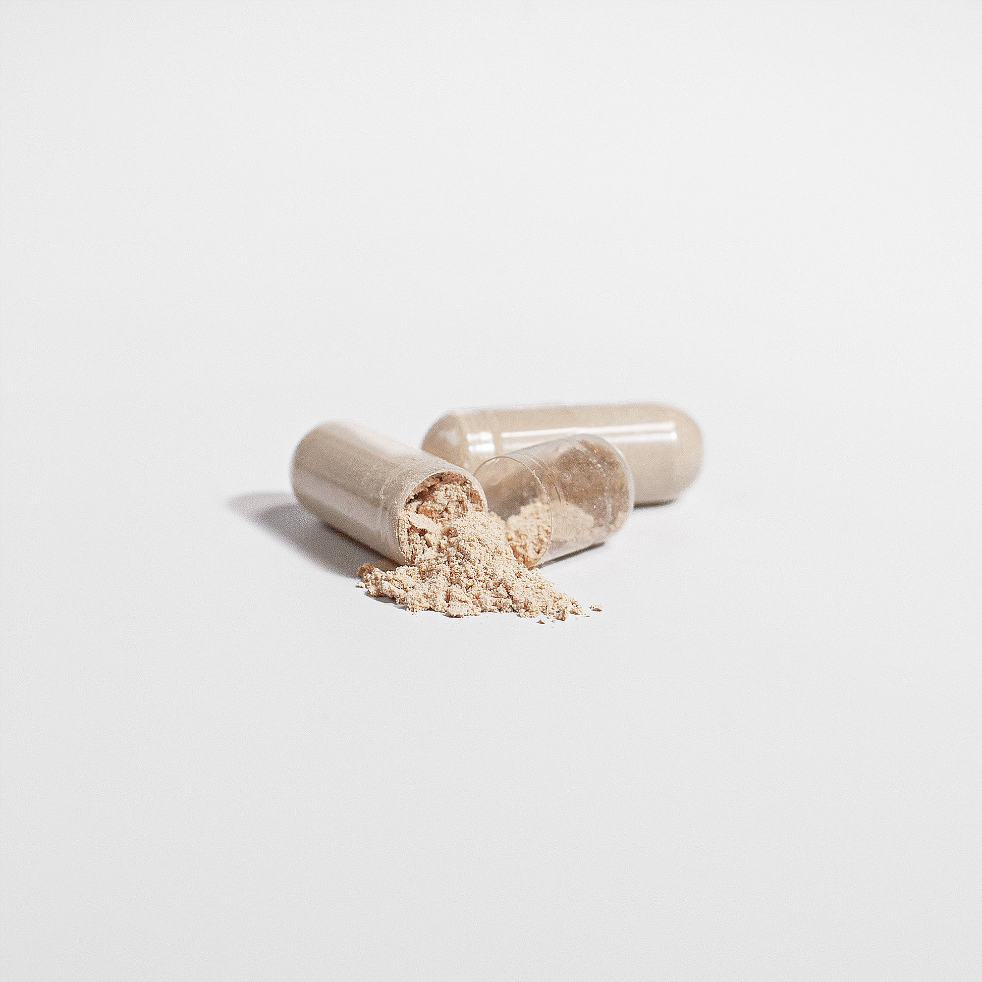 Fuelchemy Chaga mushroom supplement capsules with powder spilling out for health enthusiasts