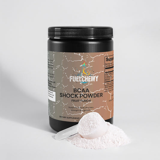 Fuelchemy Fruit Punch BCAA powder in a black container with a scoop and powder spill