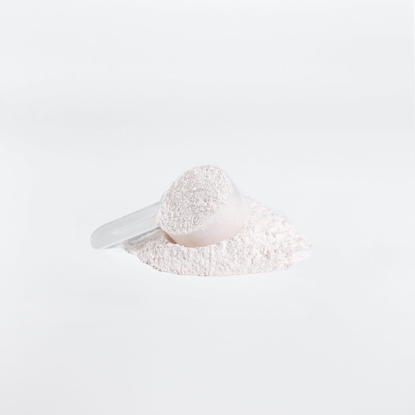 Fuelchemy BCAA post workout supplement powder with a clear measuring scoop on white background