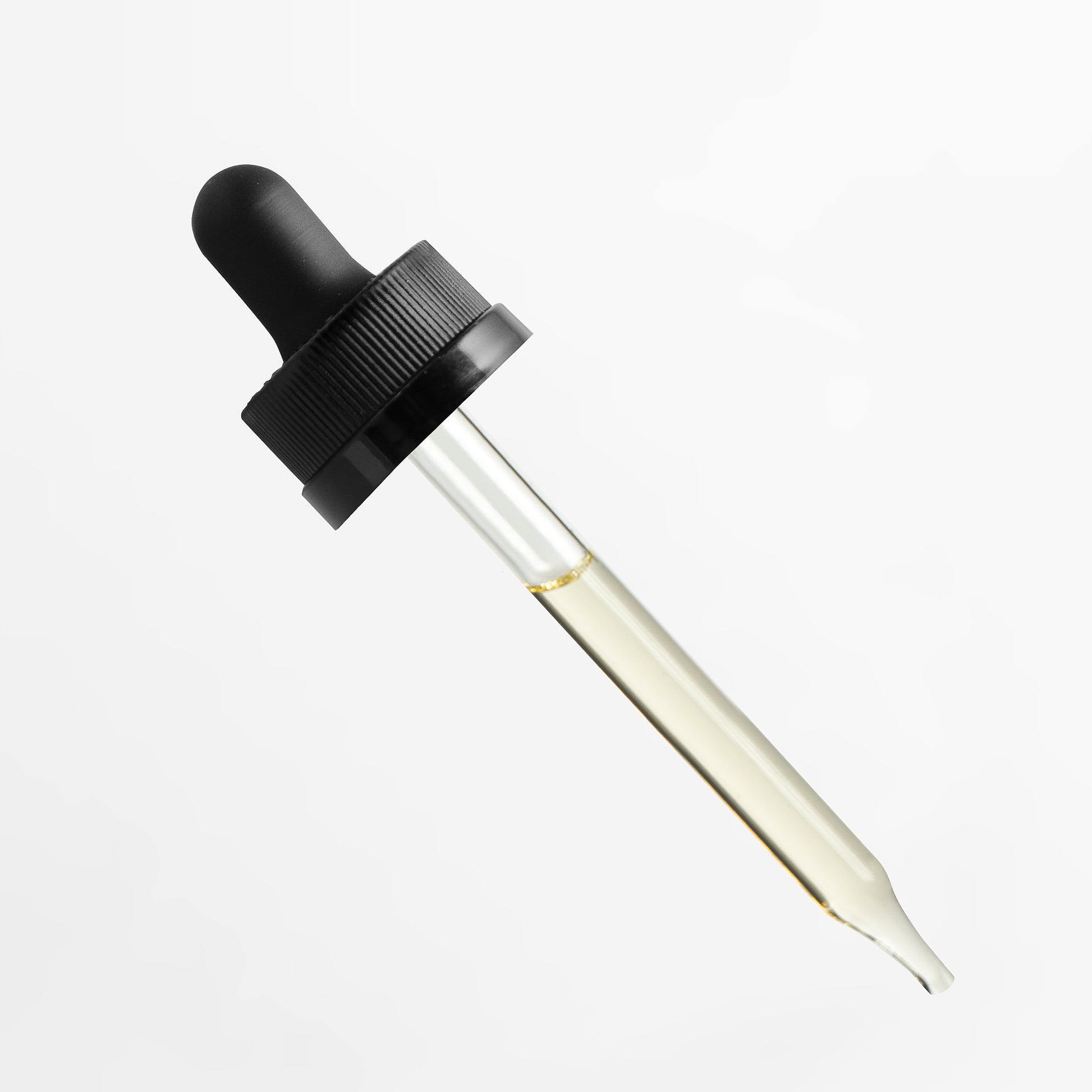 Fuelchemy botanical hair growth serum in a dropper bottle for promoting healthy hair growth