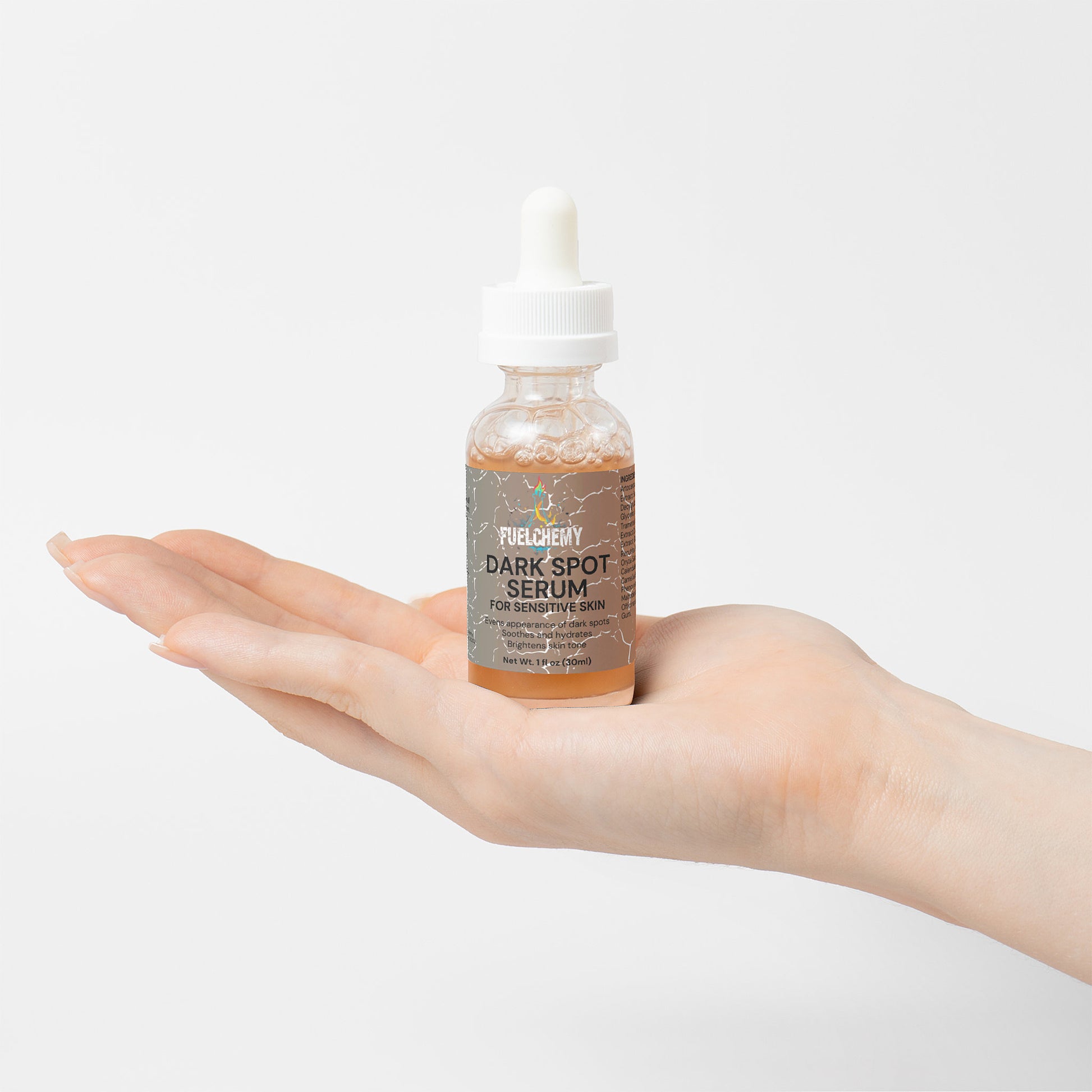 Fuelchemy Dark Spot Serum for Sensitive Skin in a dropper bottle held in a hand