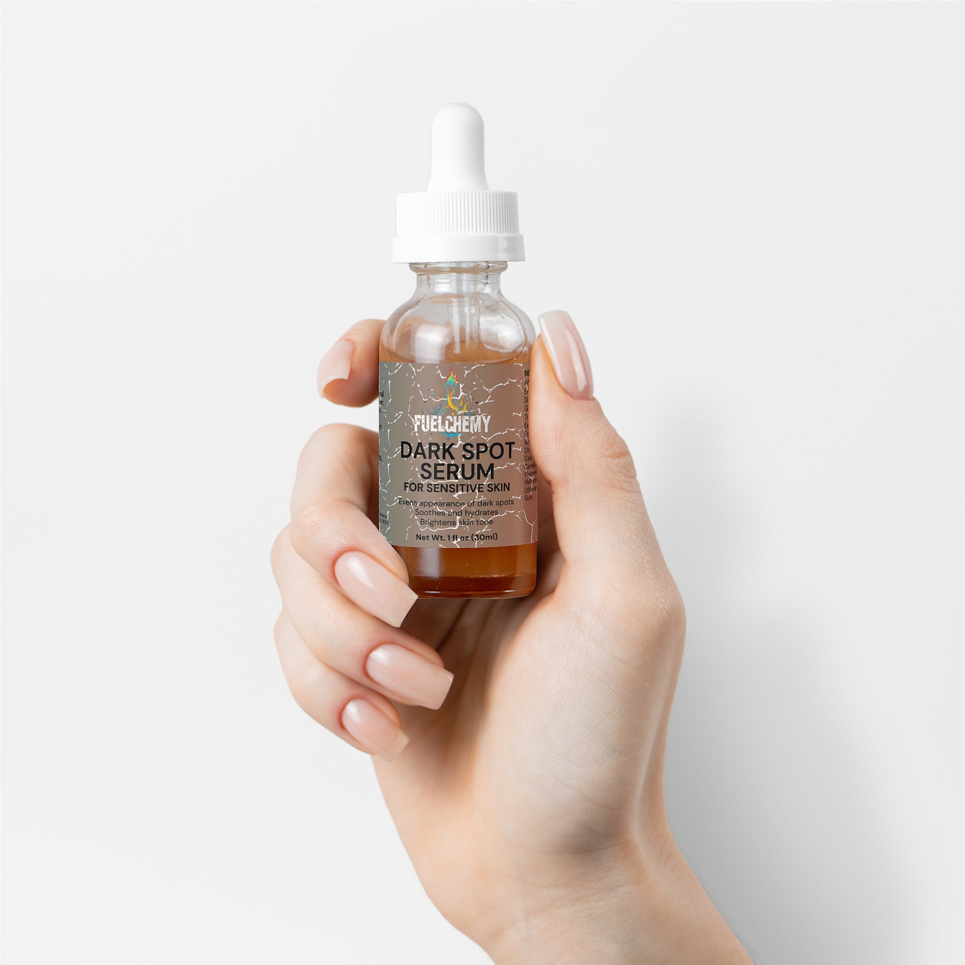 Fuelchemy dark spot serum sensitive skin in a dropper bottle held in a hand for skincare routine